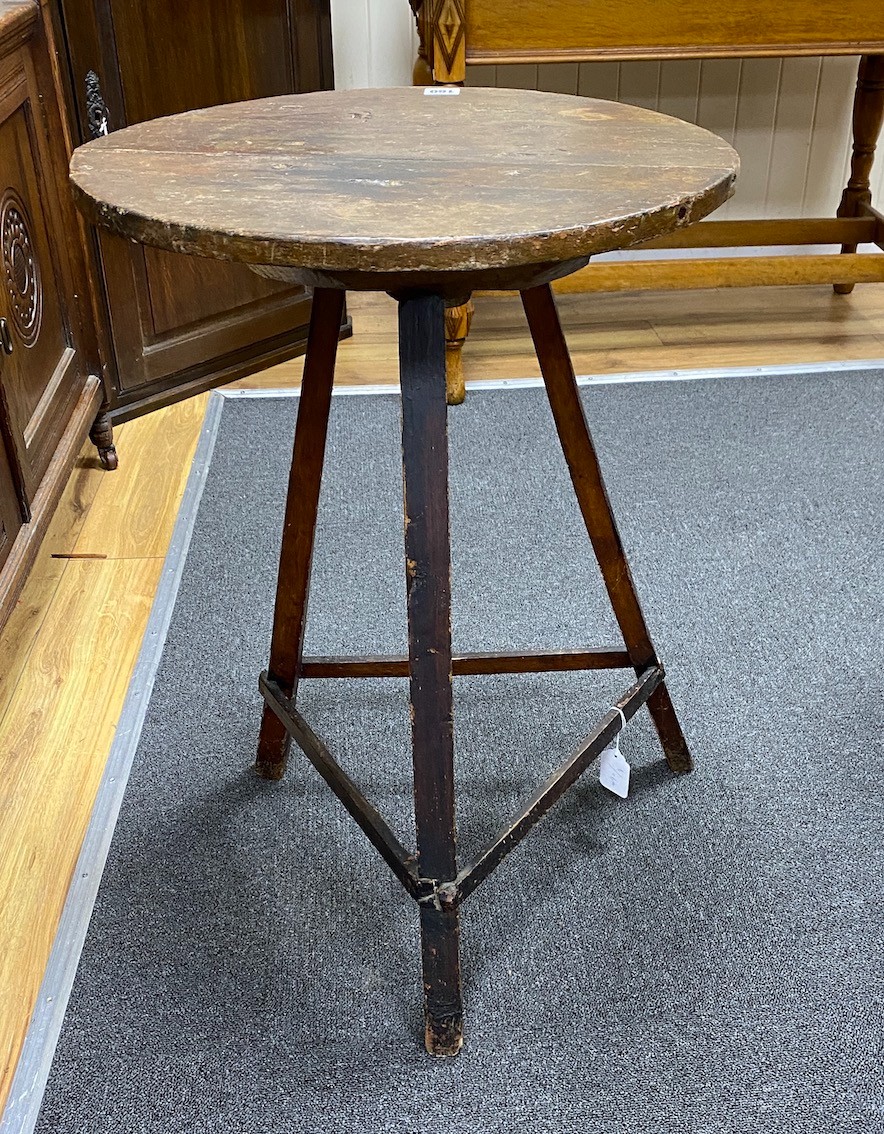 A 19th century circular primitive cricket table, diameter 49cm, height 71cm